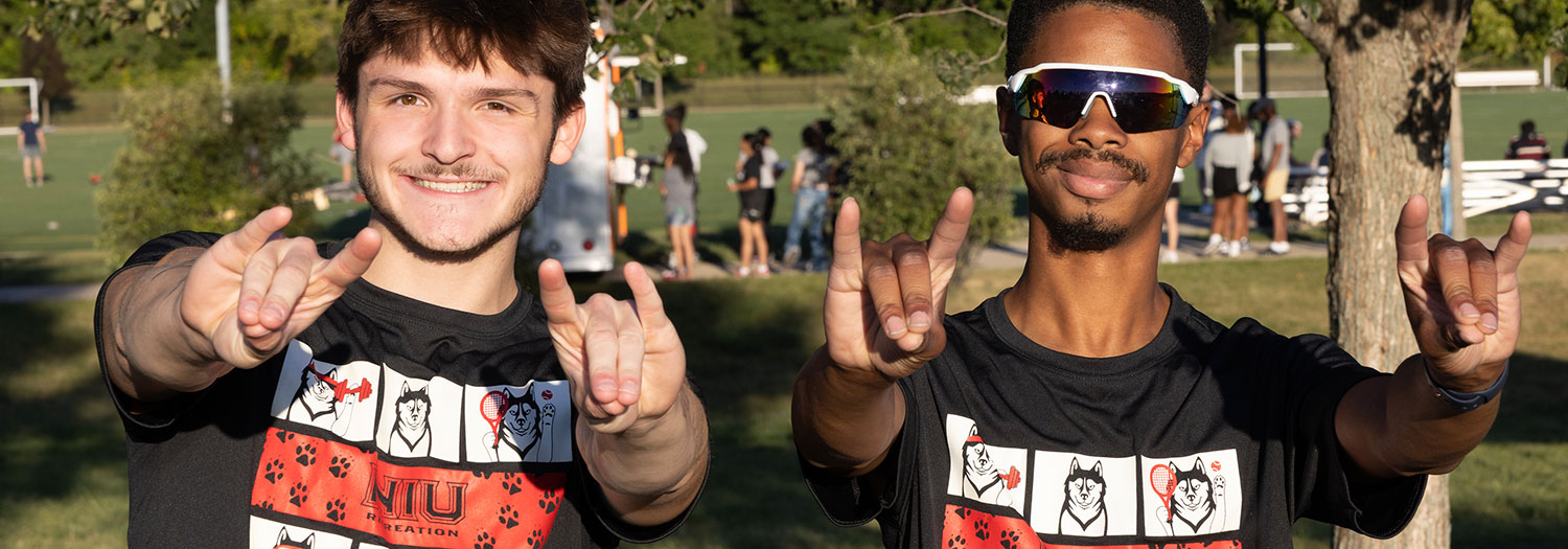 Two smiling students at recreation event
